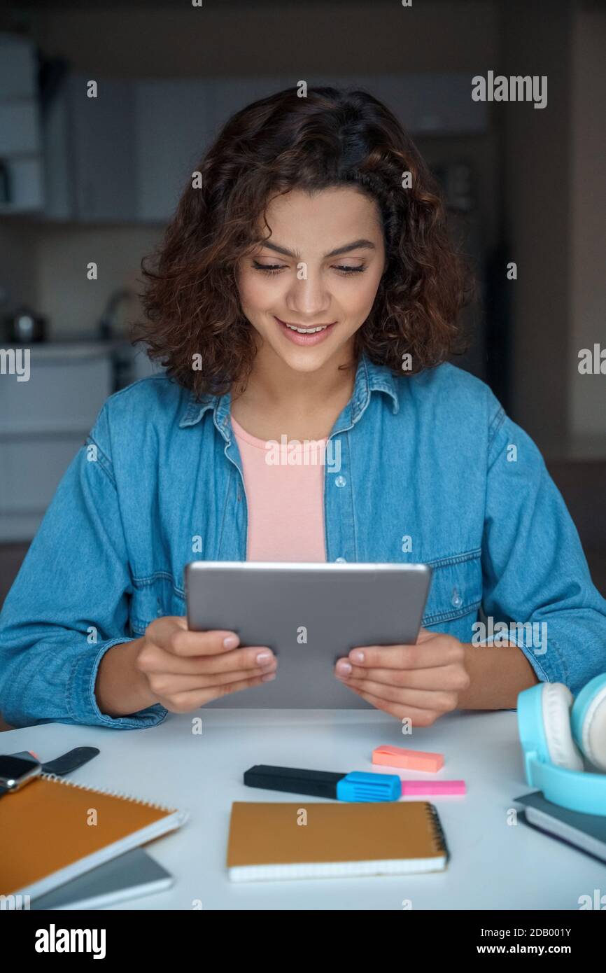 Young woman using computer tablet and working and studying online. Stock Photo