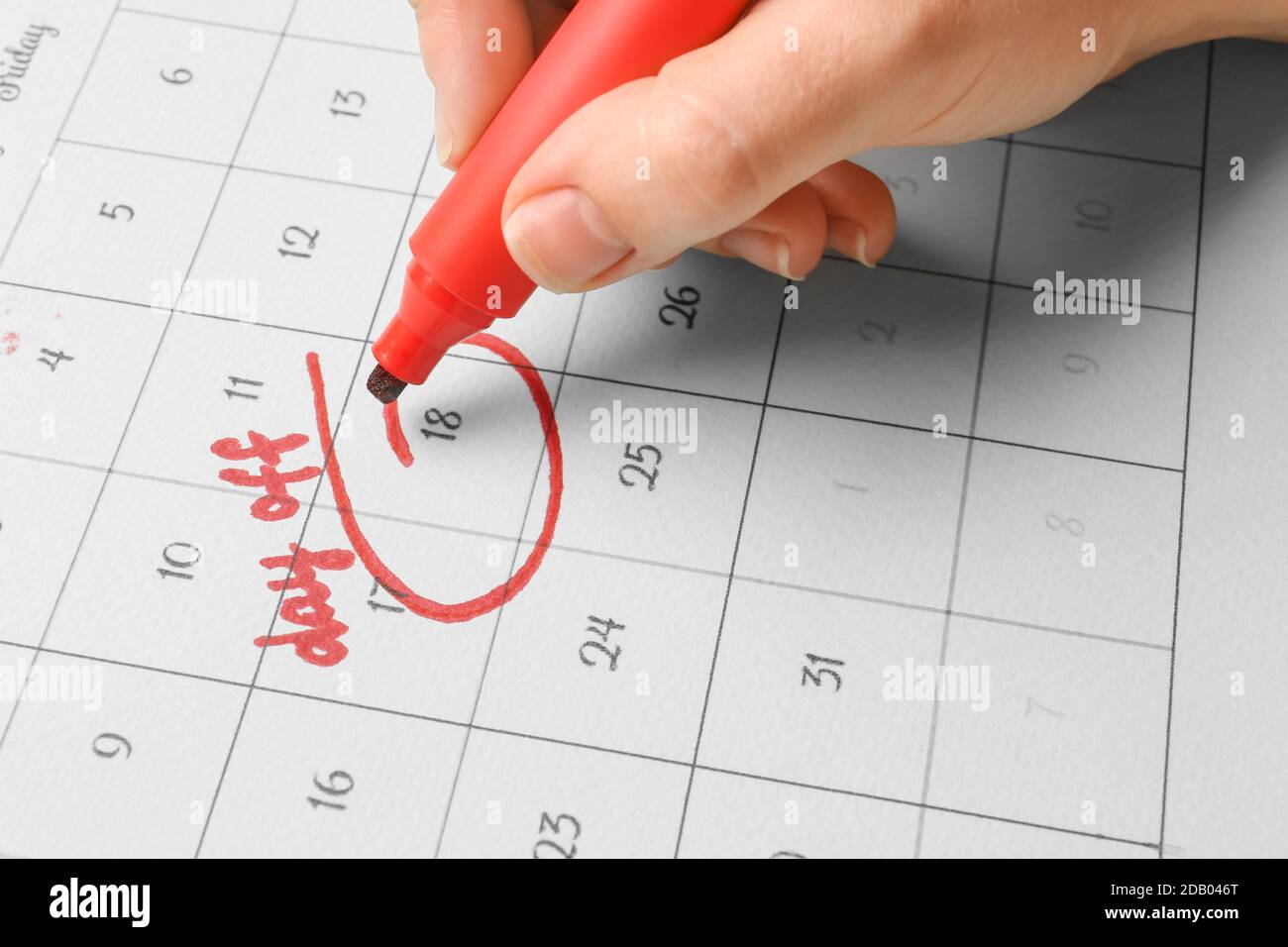 Woman marking day off in calendar, closeup Stock Photo Alamy
