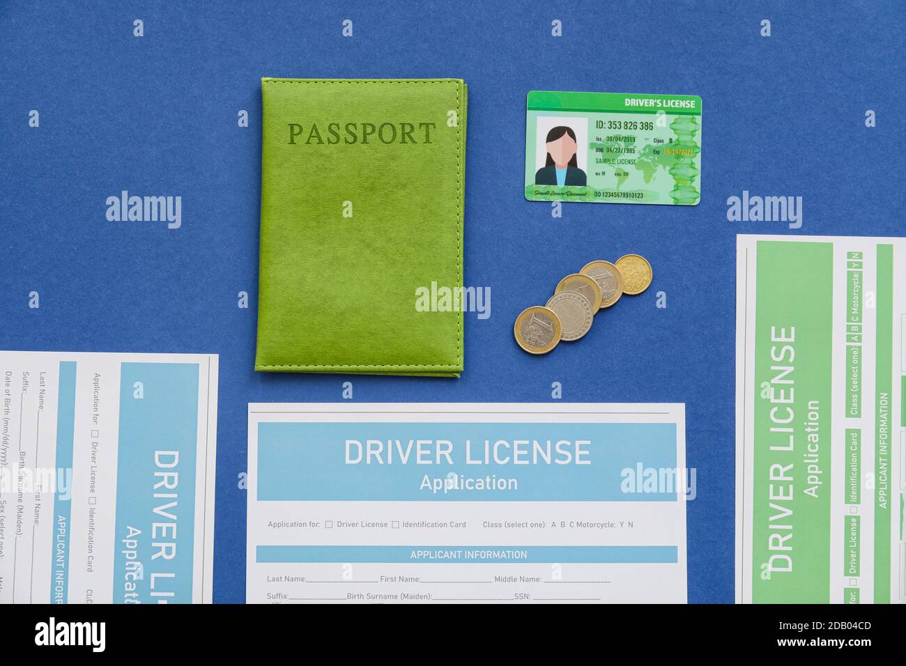 Driving license with passport and application forms on color background