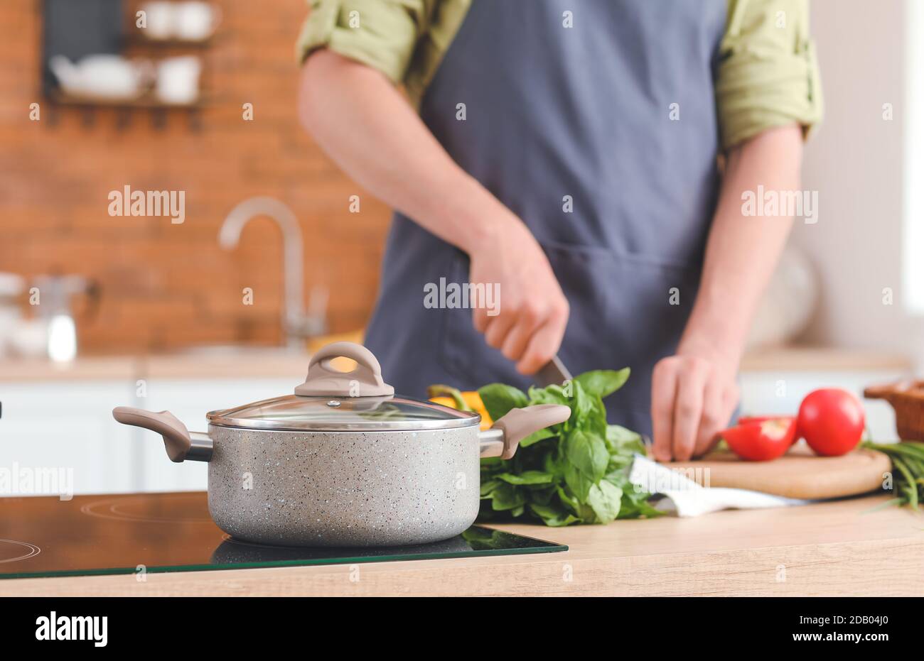 Induction cooking male hi-res stock photography and images - Alamy