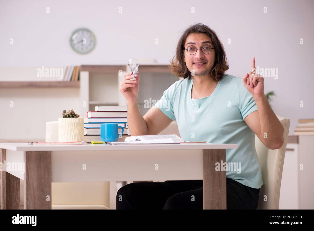 Young student preparing for exams at home Stock Photo - Alamy