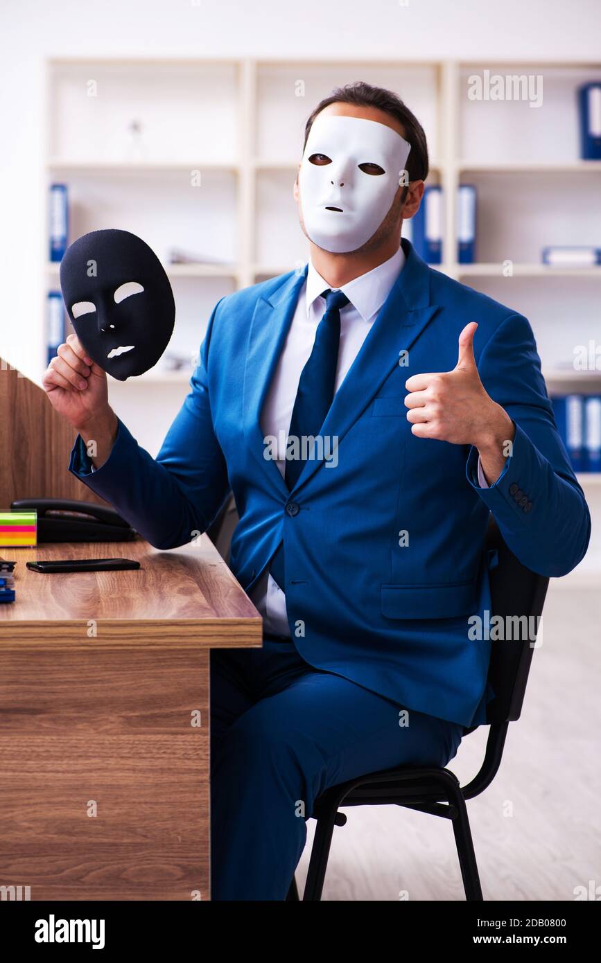 Young man wearing anonymous mask hi-res stock photography and images ...