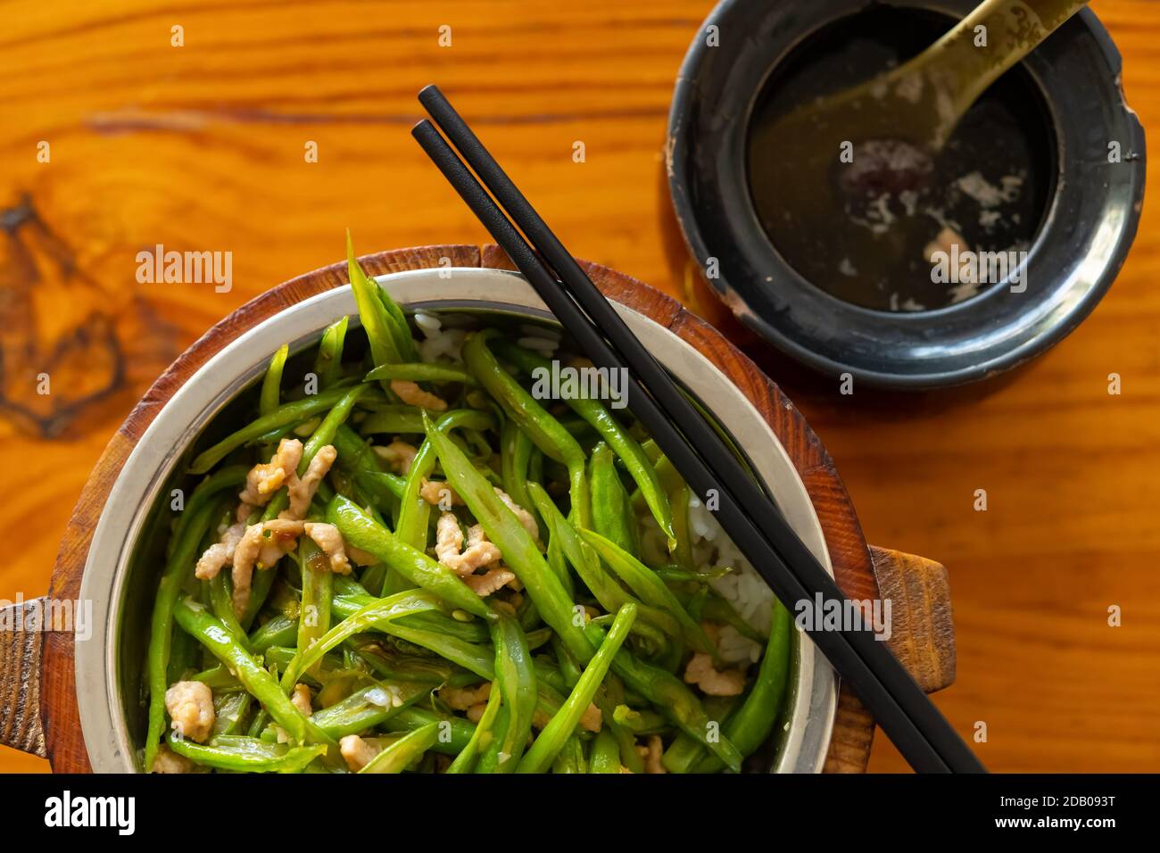 top view fast food green beans and pork with rice and soup horizontal composition Stock Photo