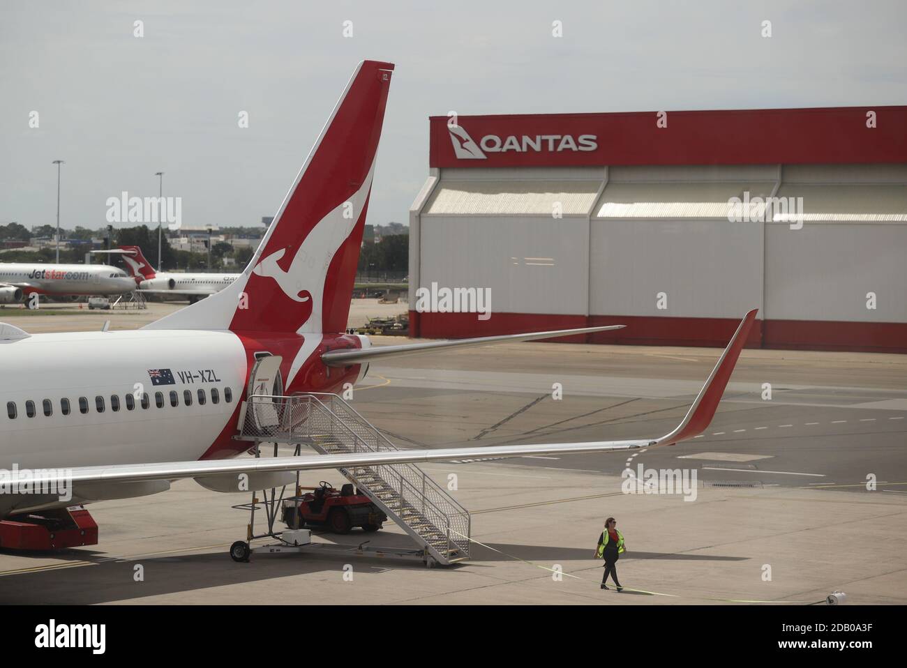 A crew member walks from a Qantas plane at a domestic terminal at Sydney Airport in Sydney, Australia, November 16, 2020.  REUTERS/Loren Elliott Stock Photo
