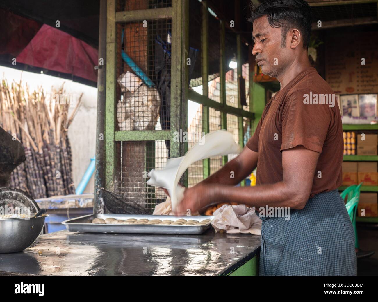 Man making roti at local restaurant in Myeik, Tanintharyi Region, Myanmar Stock Photo