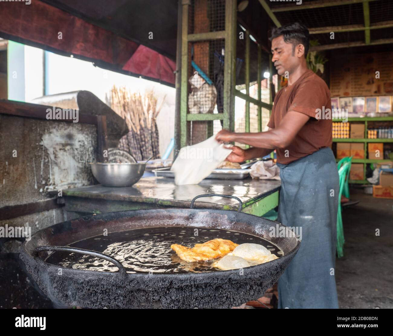 Man making roti at local restaurant in Myeik, Tanintharyi Region, Myanmar Stock Photo