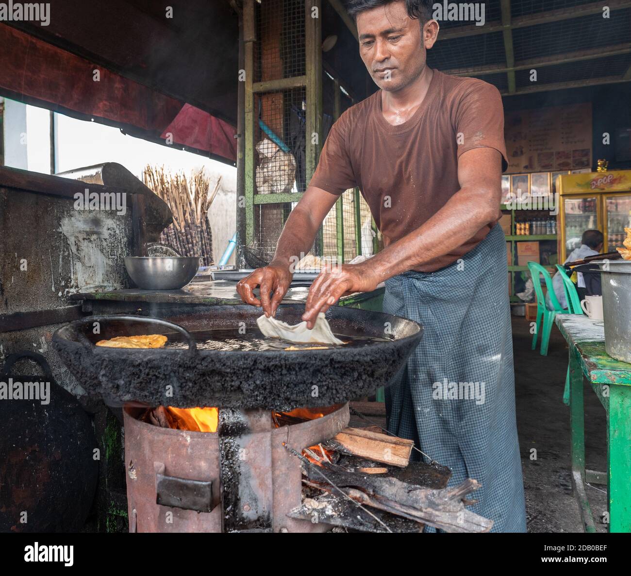 Man making roti at local restaurant in Myeik, Tanintharyi Region, Myanmar Stock Photo