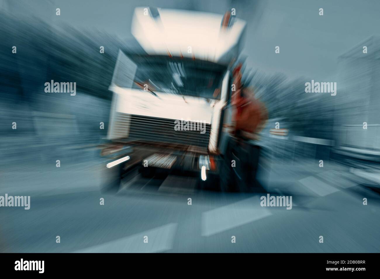 Truck in a blur on the road in motion. The danger of a collision or emergency situation. Violation of rules by truckers Stock Photo
