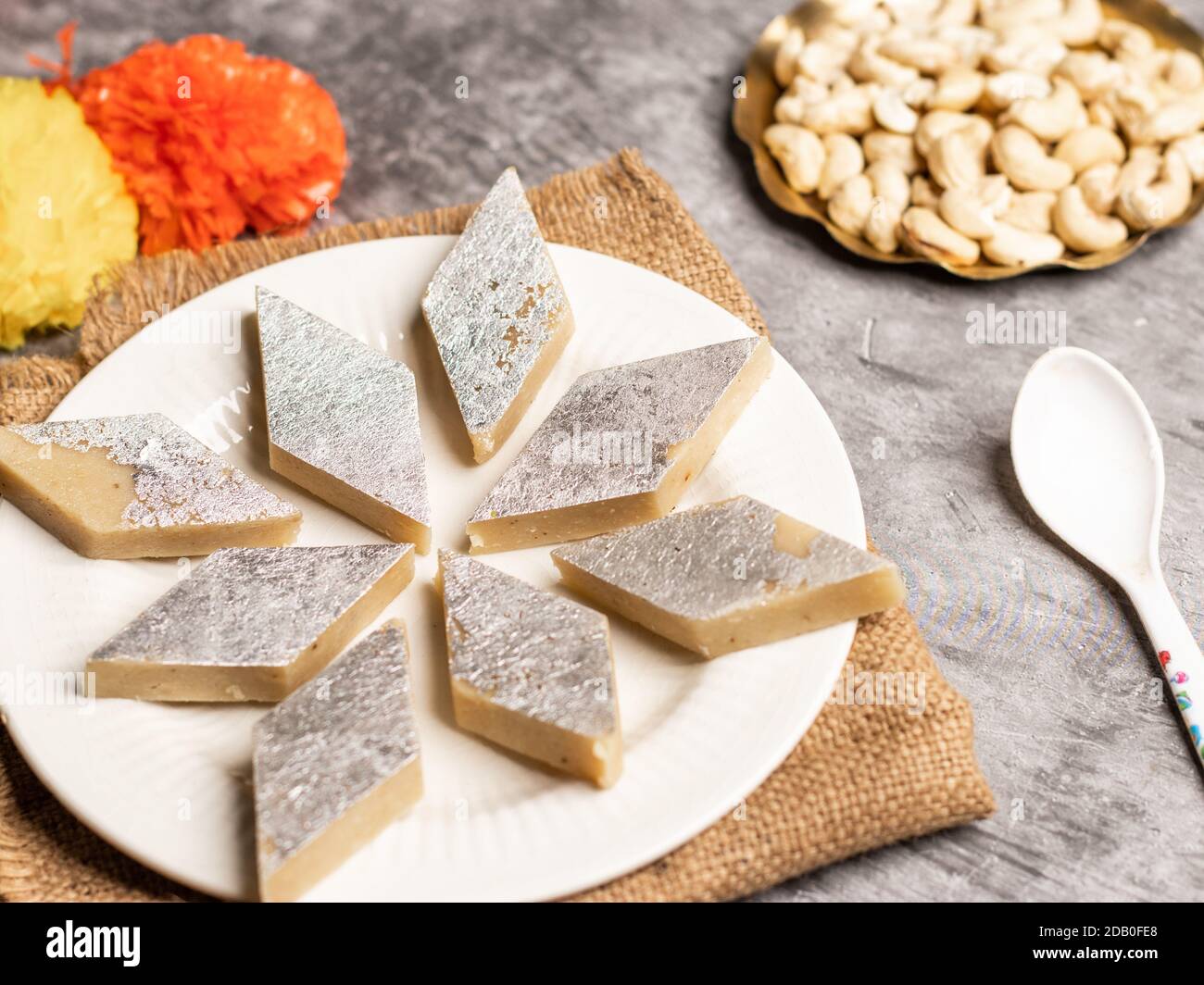 Kaju katli / kaju barfi is a diamond shape indian sweet made with using ...