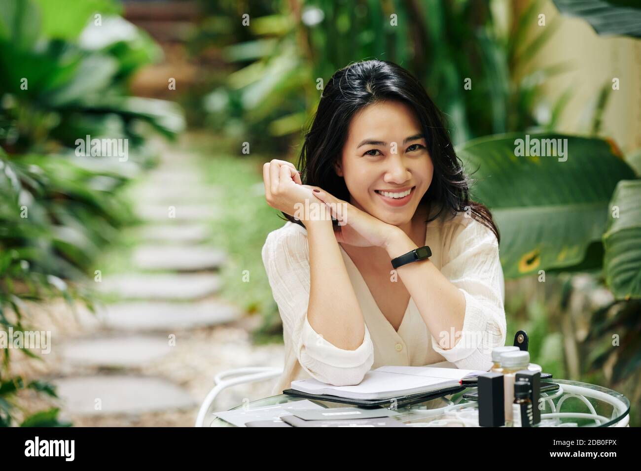 Attractive smiling young Asian woman Stock Photo