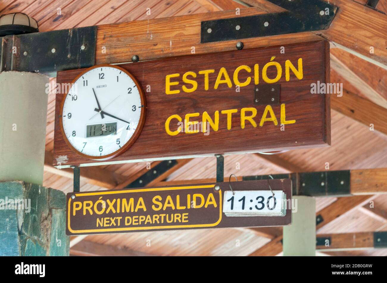 A station clock at Central rail station which serves the Jungle train (Rainforest Ecological Train) approaching Central Station in Iguazu National Par Stock Photo