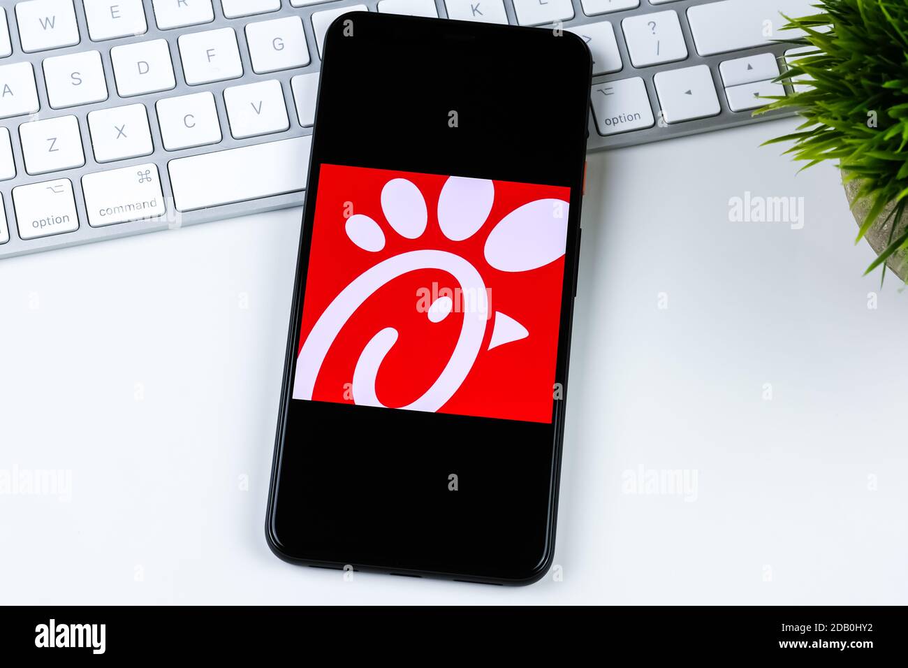 Chick-fil-A app logo on a smartphone screen. Stock Photo
