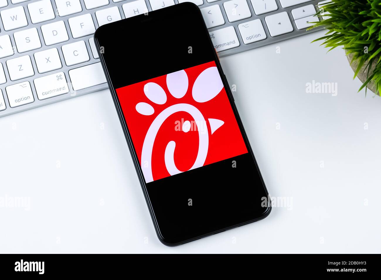 Chick-fil-A app logo on a smartphone screen. Stock Photo