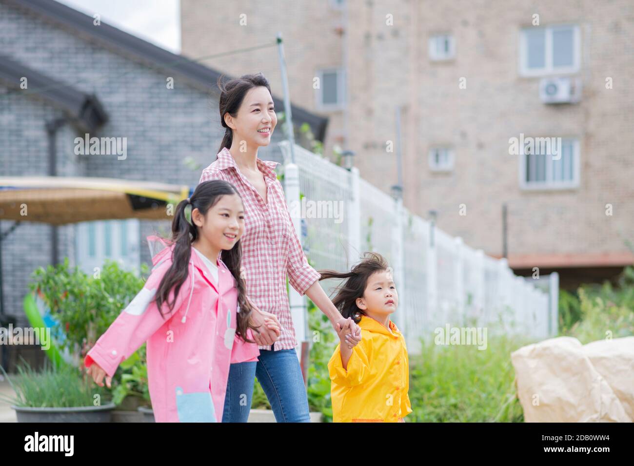 Portrait of happy cheerful family, young mother and two daughters 244 Stock Photo