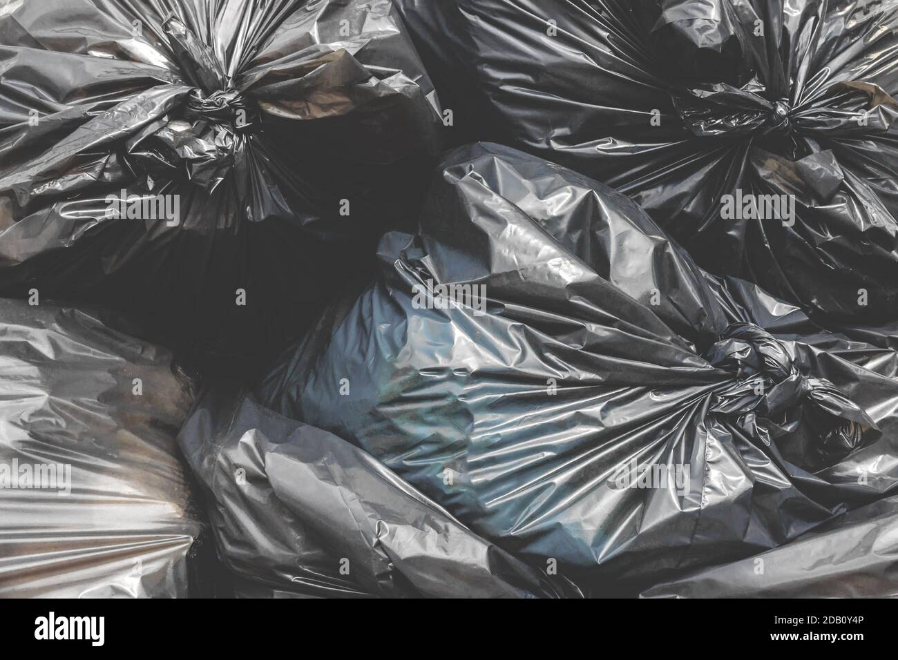 Garbage pile black plastic bags and trash bag waste pollution. Stack of
