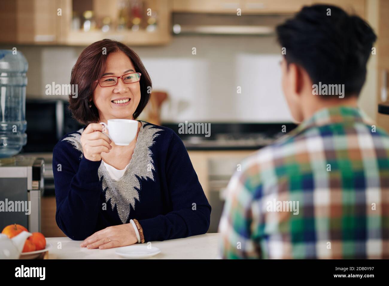 Mother talking to son Stock Photo