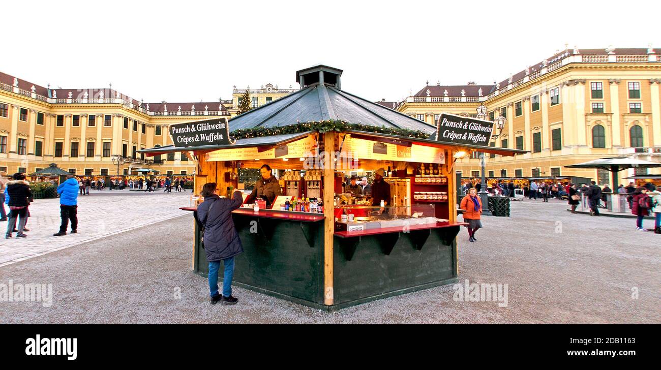 kiosk with punch and mulled wine on occassion of the advent market in front of the palace of Schoenbrunn at Vienna, Austria Stock Photo