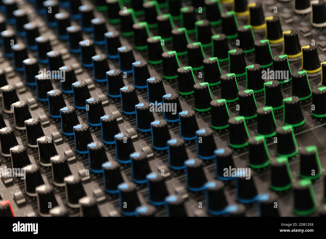 Buttons and knobs to adjust a mixer for music and sound processing Stock Photo
