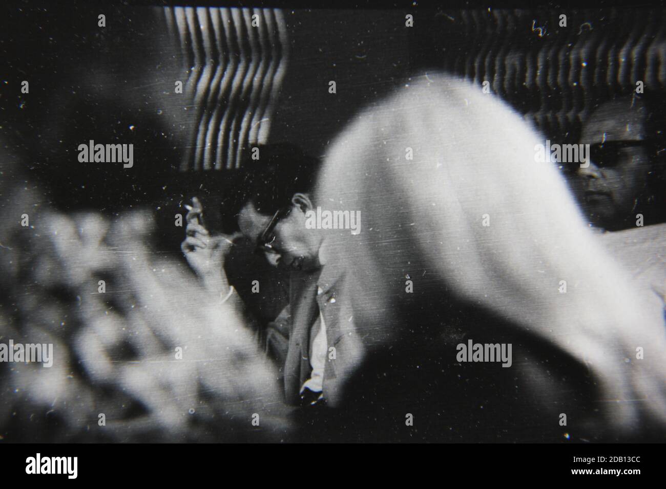 Fine 1970s Vintage Black And White Photography Of A Young Man Smoking A Cigarette And Having A Friendly Conversation Image383980878
