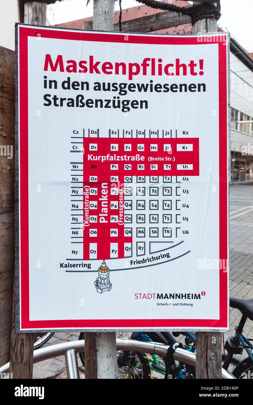 Signboard informing citizens of areas where wearing community masks is mandatory during the second wave of Covid-19 in Mannheim, Germany Stock Photo