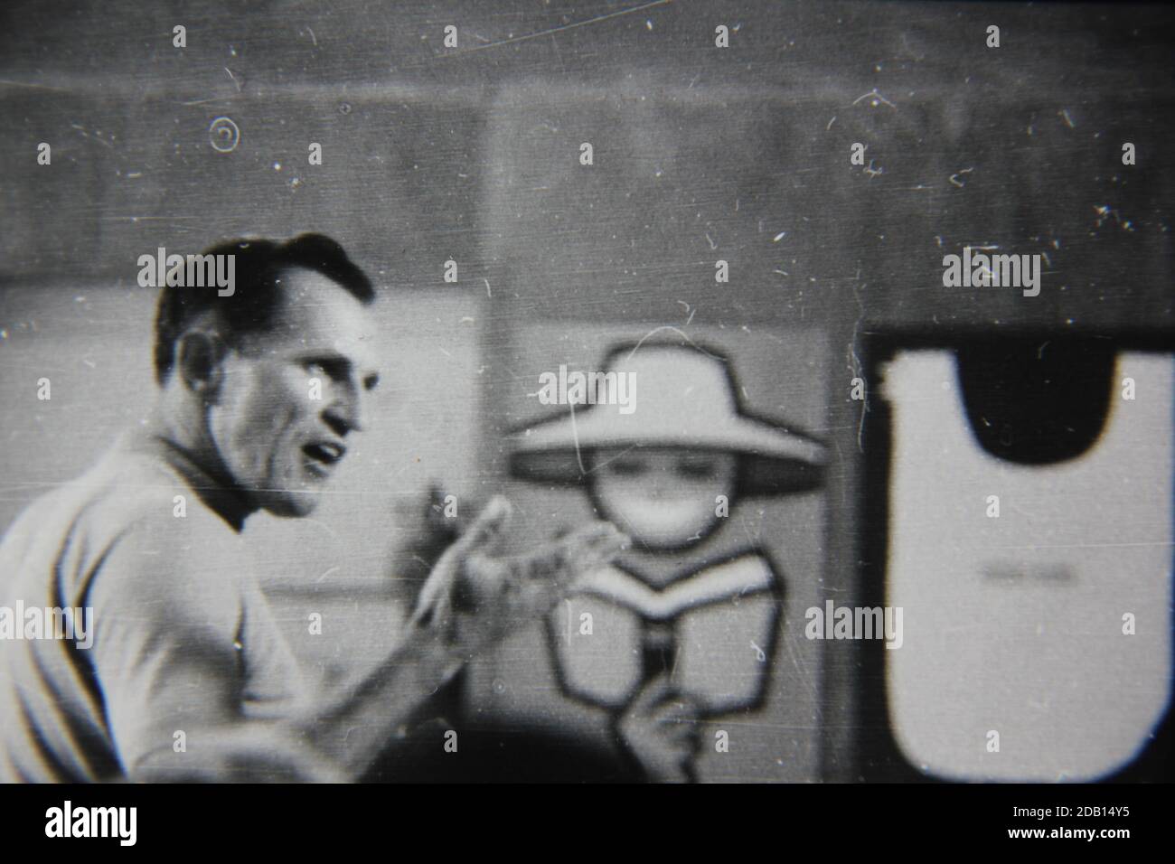 Fine 1970s vintage black and white photography of a speaker speaking in front of a live audience. Stock Photo