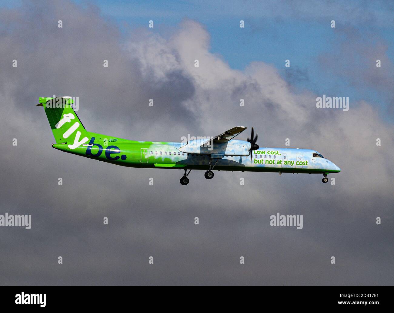 A Dehavilland DCH-8-402q turbo prop airliner G-JEDP from Flybe in its pre 2014 paint scheme colours. Stock Photo