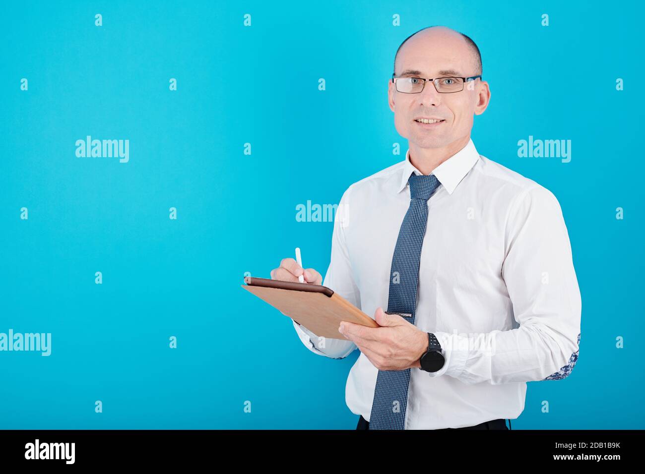 Manager writing on tablet Stock Photo
