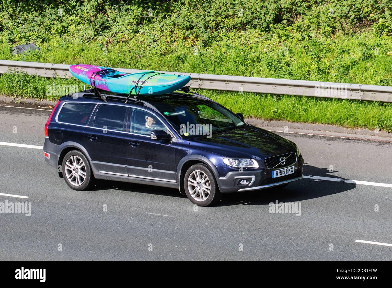 2016 Volvo Xc70 SE LUX D5 AWD Auto; Vehicular traffic, moving vehicles, cars, vehicle driving on UK roads, motors, motoring on the M6 motorway highway UK road network. Stock Photo