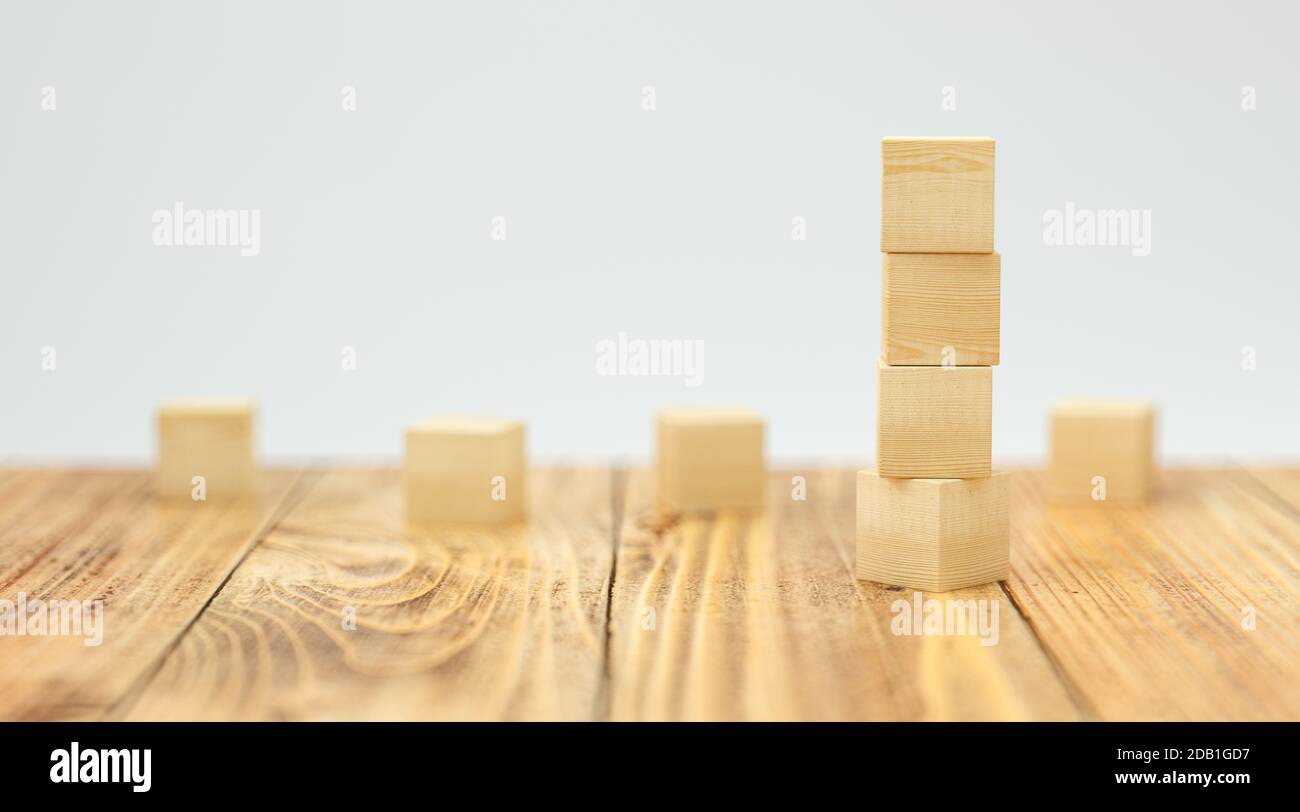 empty wooden cubes for own messages and icons on wooden floor and white ...