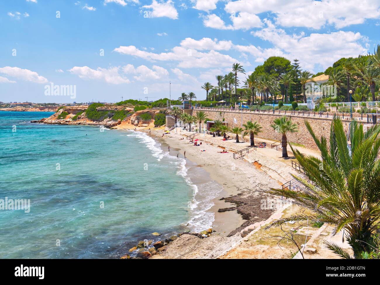 Sandy beach and Mediterranean sea view during warm sunny day