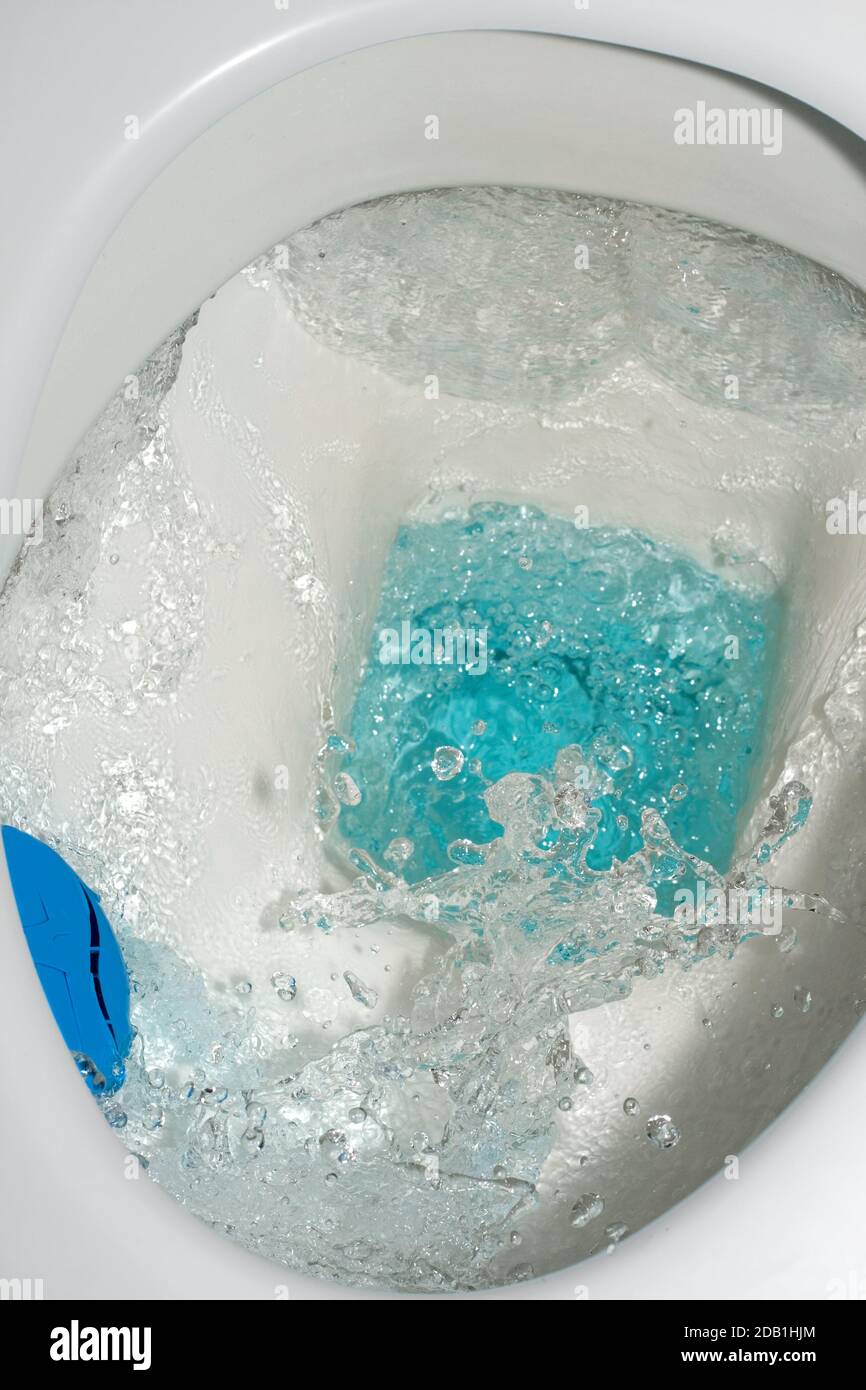 Toilet from above,drip drop bubble splash wasting water Stock Photo