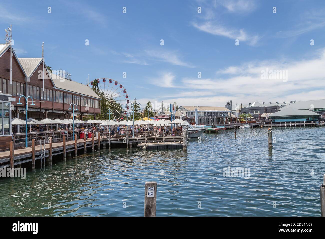 Fremantle waterfront boardwalk at the fishing boat harbour, a marina with seafood restaurants Stock Photo