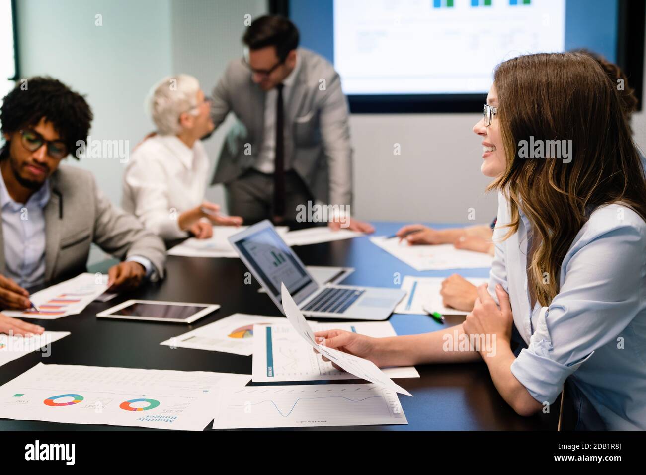 Collaboration and analysis by business people working in office Stock ...