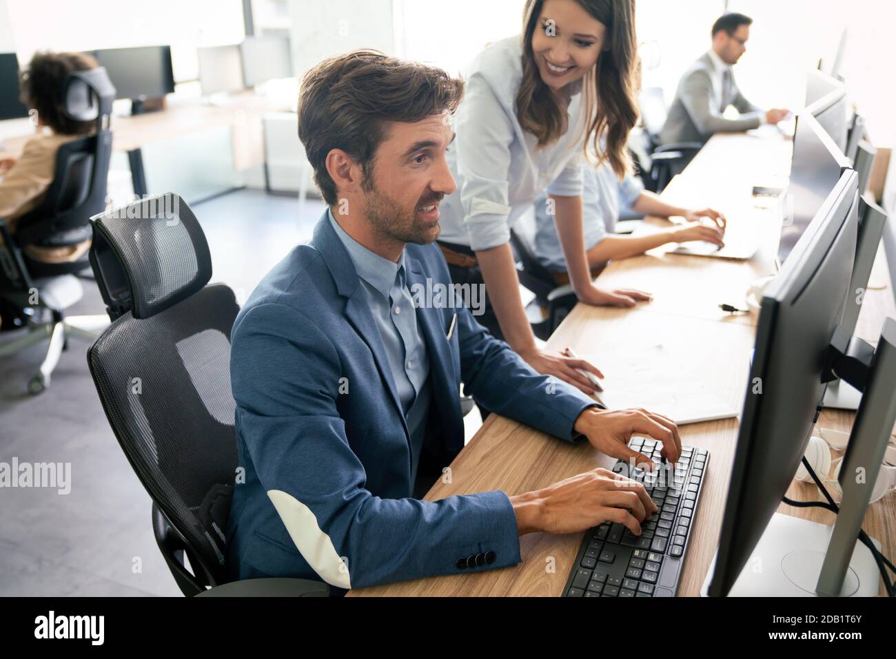 Creative people working in office on computer Stock Photo