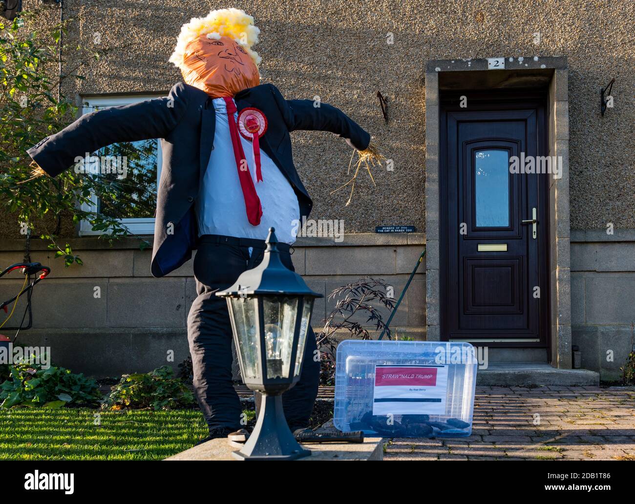 Dirleton, East Lothian, Scotland, UK, Dirleton Village scarecrow competition:  the first project of the village Good Neighbours’ “Reasons to be Cheerful” project encourages residents of all ages to create a scarecrow. The project is funded by a grant from North Berwick Coastal Area Partnership. The aim is bring some fun to this challenging time. A Donald Trump scarecrow Stock Photo