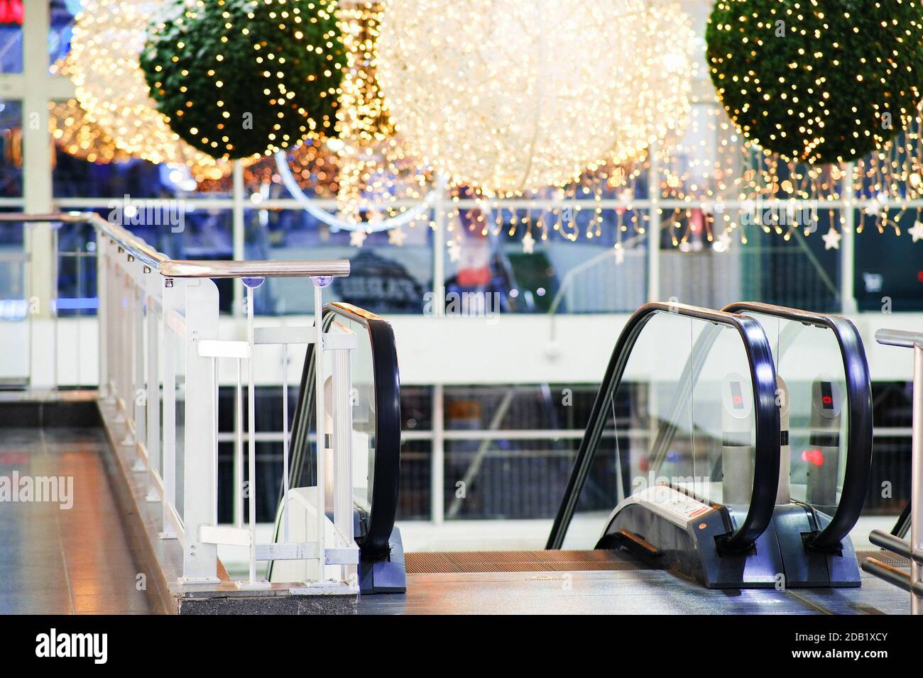 Christmas shopping center escalator, beautiful holiday eve illumination. The interior decoration of the store Stock Photo