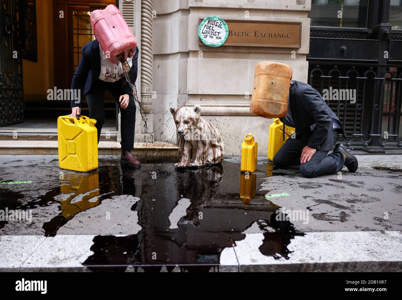 Activists from the climate action group Ocean Rebellion perform a stunt outside The Baltic Exchange building in the City Of London, in London, Britain November 16, 2020. REUTERS/Henry Nicholls Stock Photo