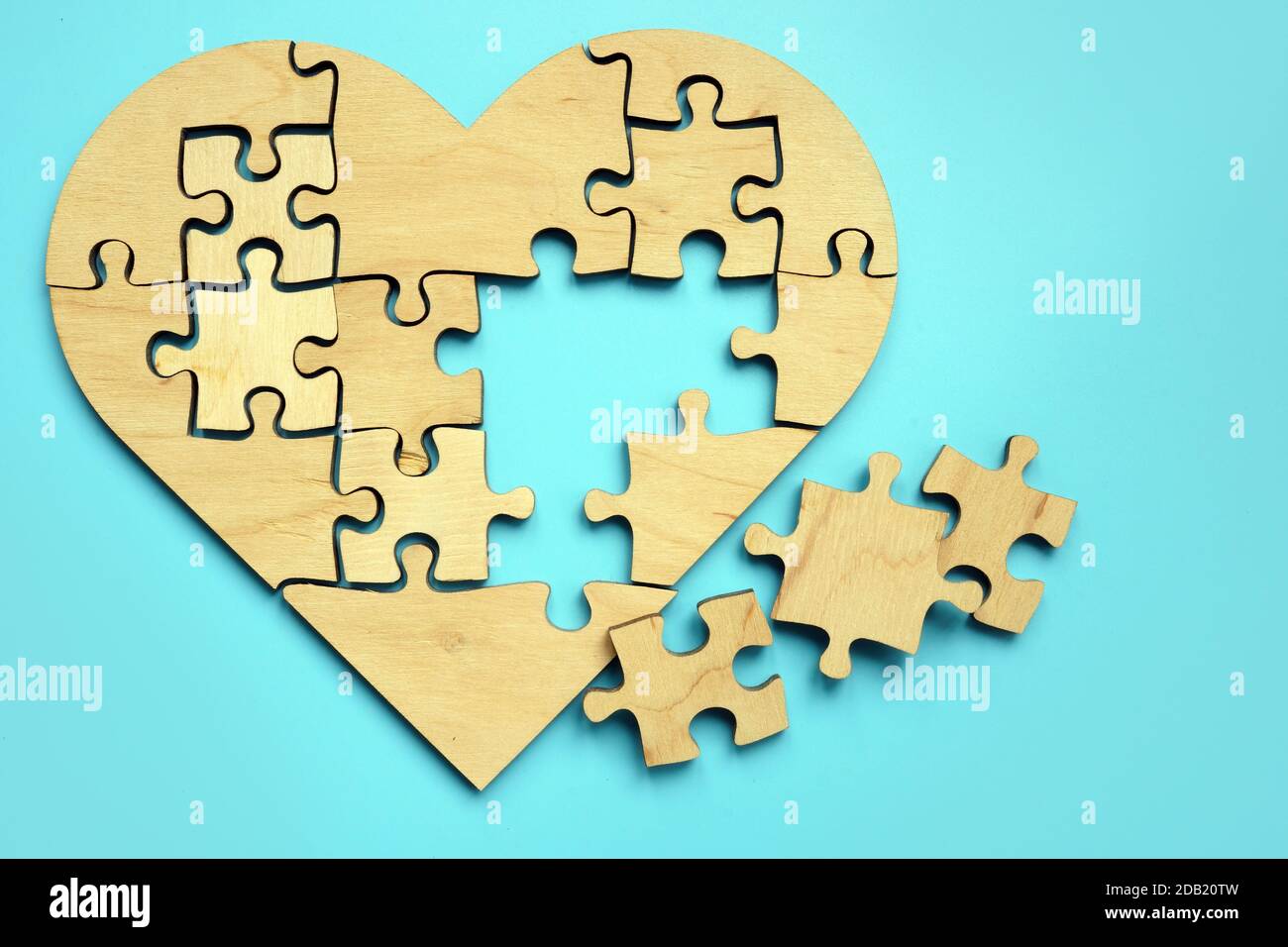 Heart made from puzzle pieces. Disease and treatment symbol. Stock Photo