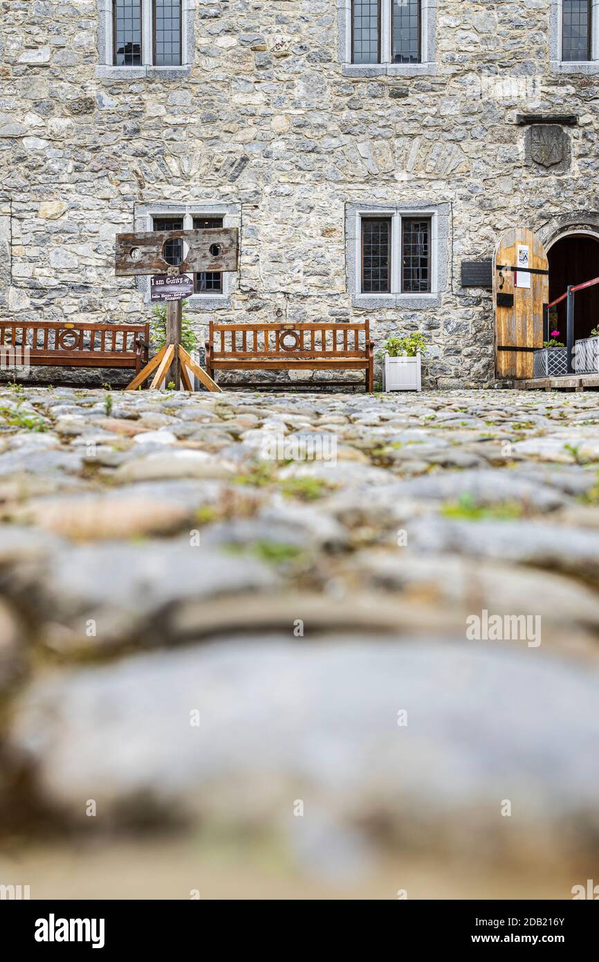 Stocks and benches in the cobbled courtyard at Rothe house, Kilkenny, County Kilkenny, Ireland Stock Photo