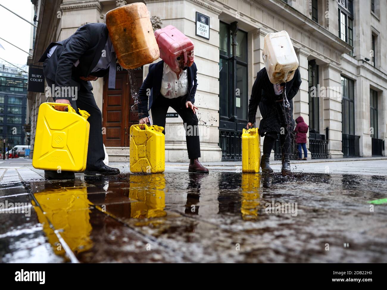 Activists from the climate action group Ocean Rebellion perform a stunt outside The Baltic Exchange building, in London, Britain November 16, 2020. REUTERS/Henry Nicholls Stock Photo