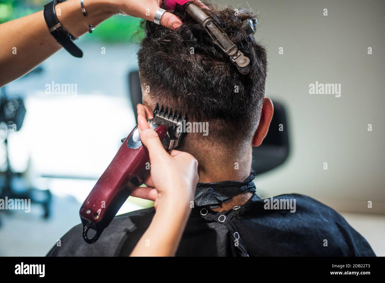 hair and beard styling. brutal guy with barbershop professional master use  electric shaver. hipster. male barber care. bearded man at hairdresser  chair in salon. beauty and fashion. Spa and Wellness Stock Photo -