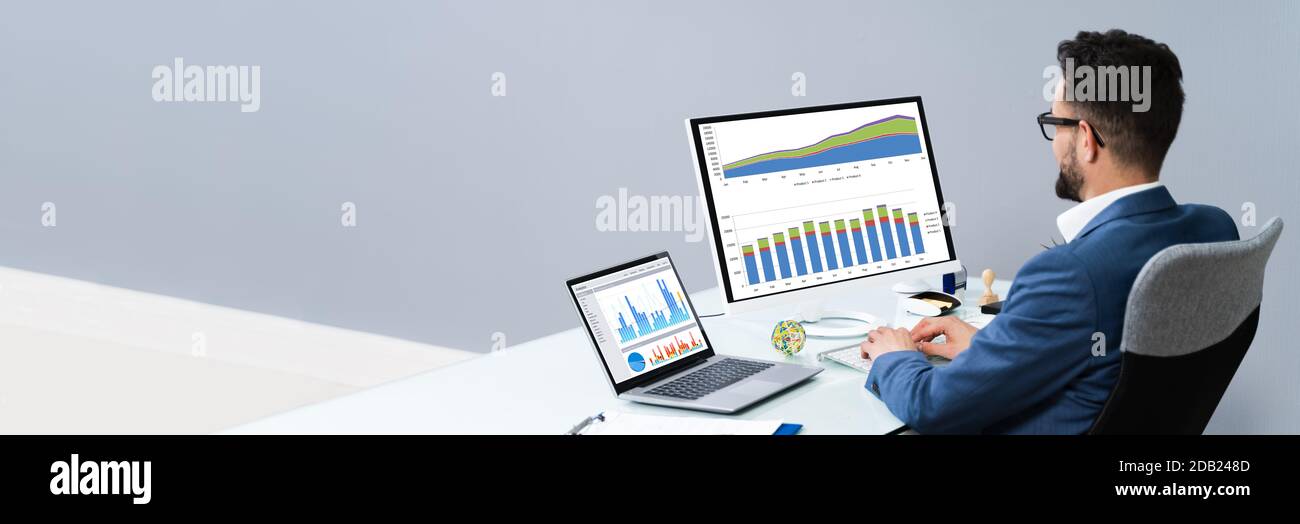 Business Analyst Man Working On Computer In The Office Stock Photo