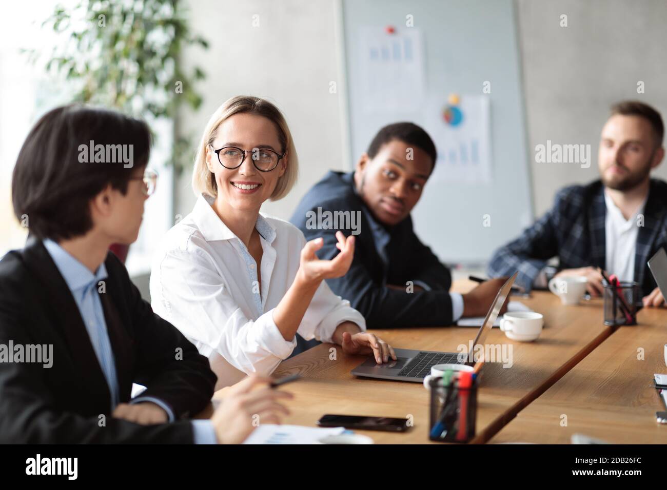 Diverse Business People Having Corporate Meeting In Modern Office Stock Photo
