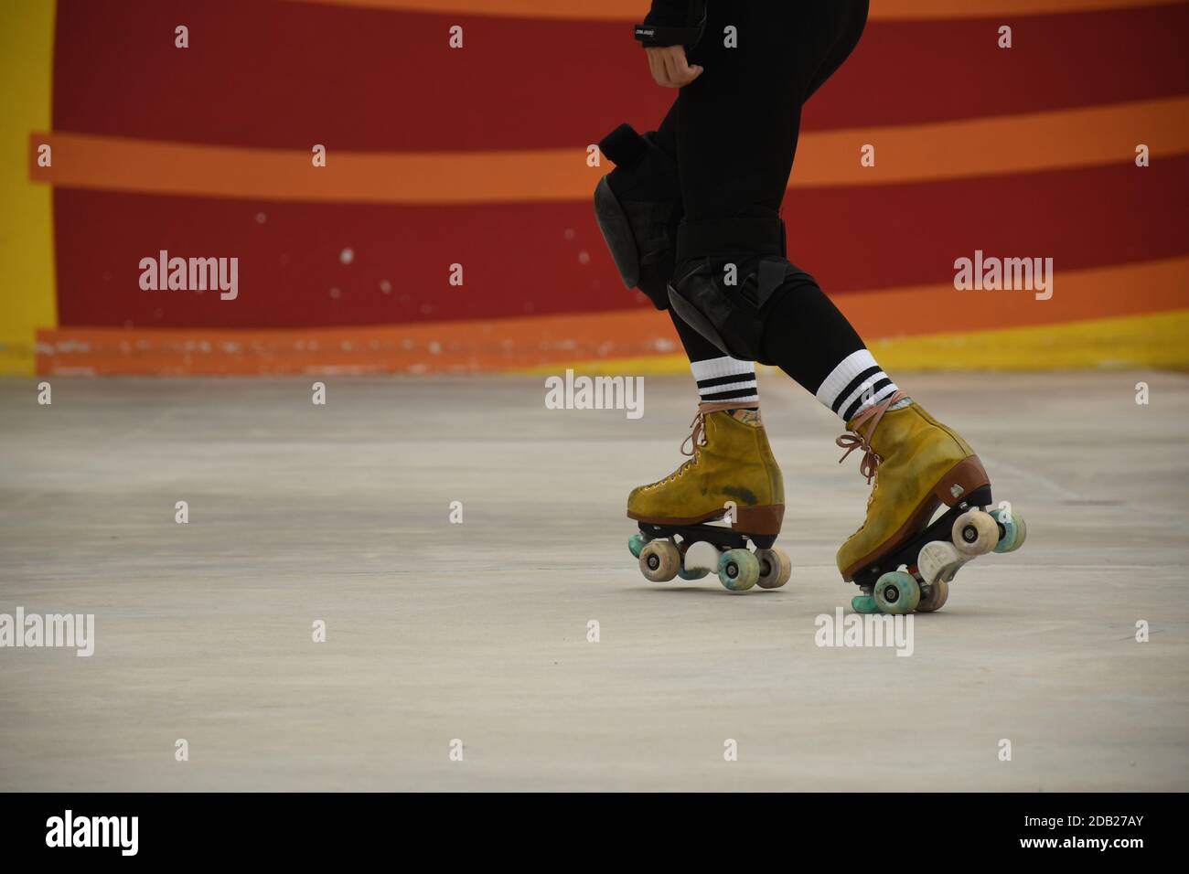 Closeup of the feet of an asian girl using roller skates inside Lai Chi