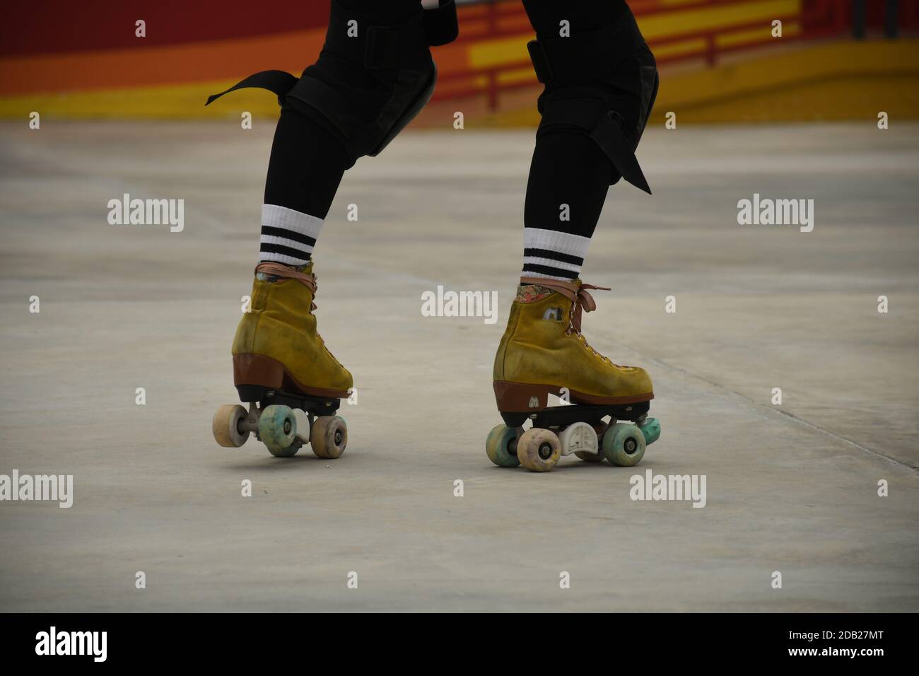 Closeup of the feet of an asian girl using roller skates inside Lai Chi