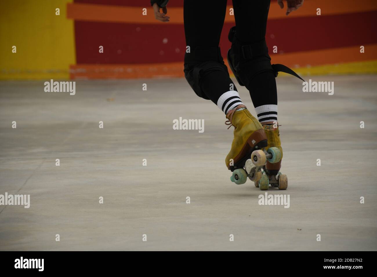 Closeup of the feet of an asian girl using roller skates inside Lai Chi