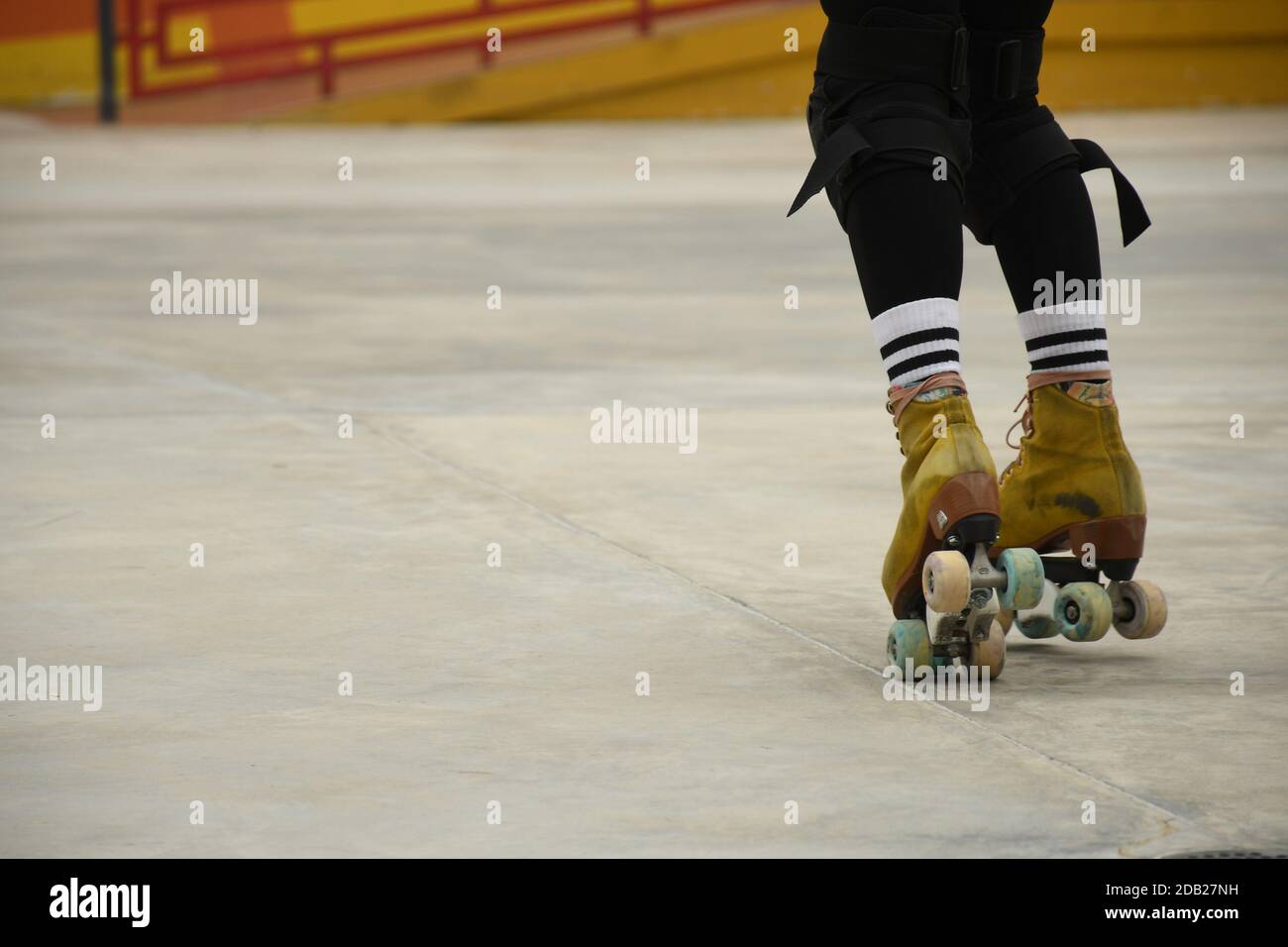 Closeup of the feet of an asian girl using roller skates inside Lai Chi