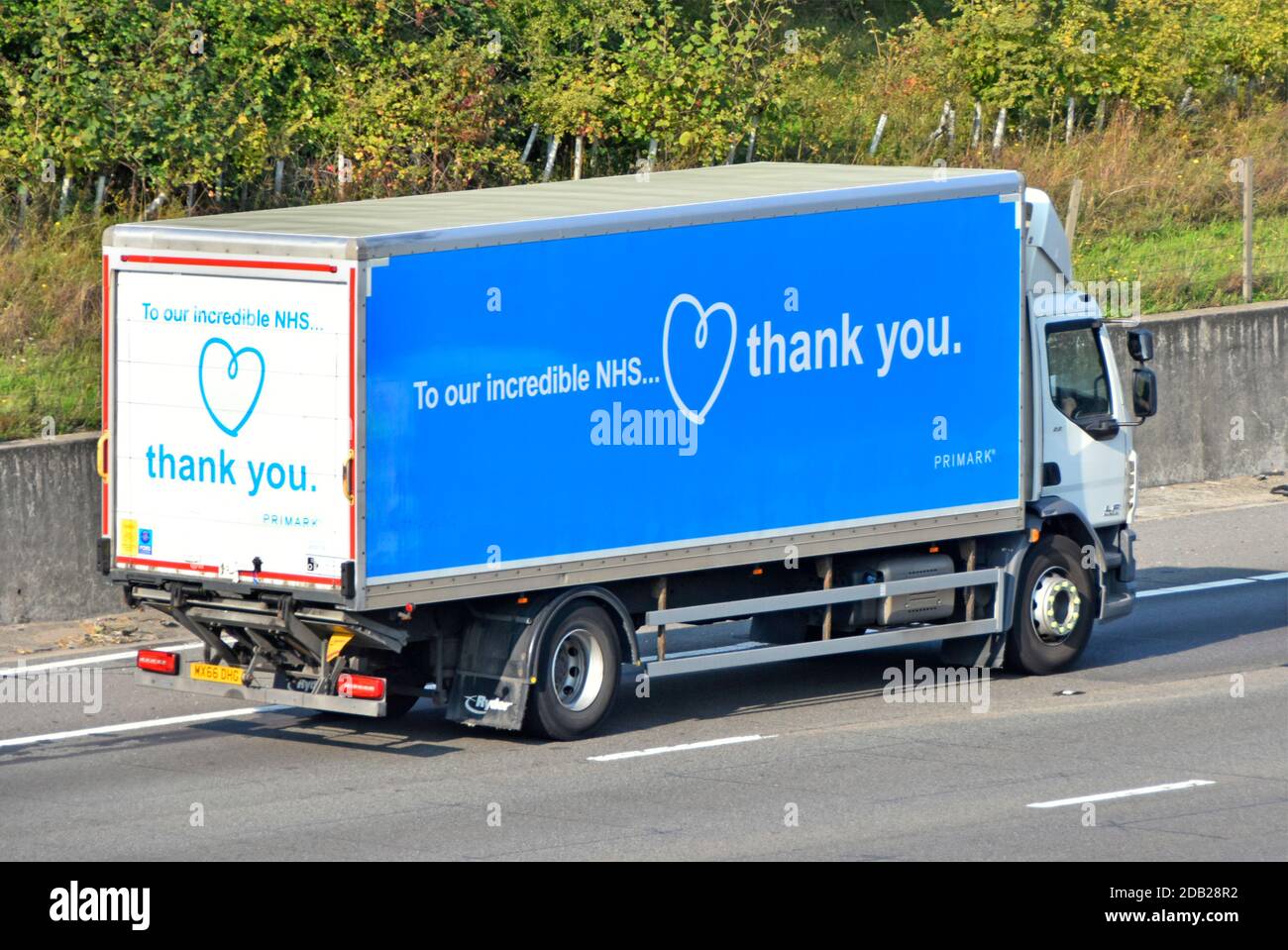 Side & back view of Primark lorry truck retail clothing store business displaying coronavirus thank you advertising to UK National Health Service NHS Stock Photo