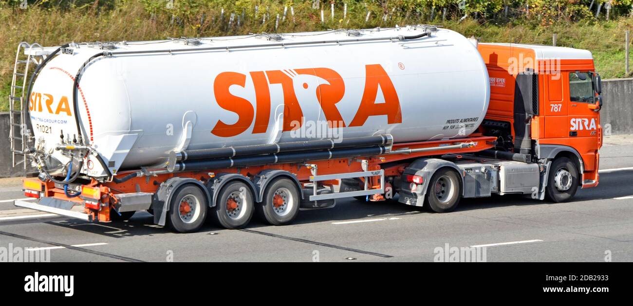 Sitra foodstuff & food supply chain transport specialists business company articulated bulk tanker trailer and lorry truck driving along uk motorway Stock Photo