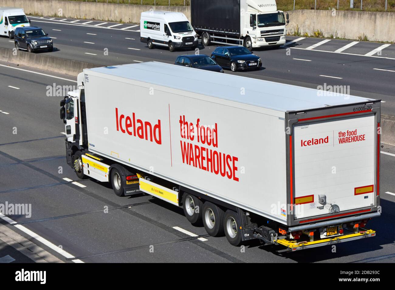 Side & back view Iceland advertising food warehouse frozen foods & groceries retail business supply chain delivery lorry truck & trailer UK motorway Stock Photo